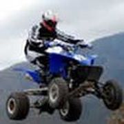 blue ATV jumping